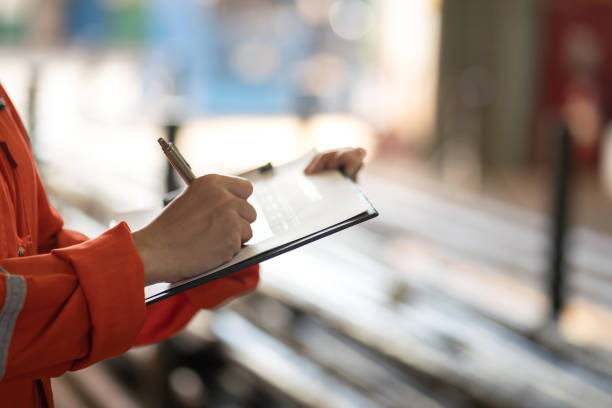 Staff member reviewing a checklist to classify an animal export consignment