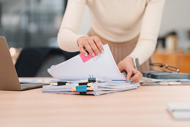 Employee organizing documents for exported animal products